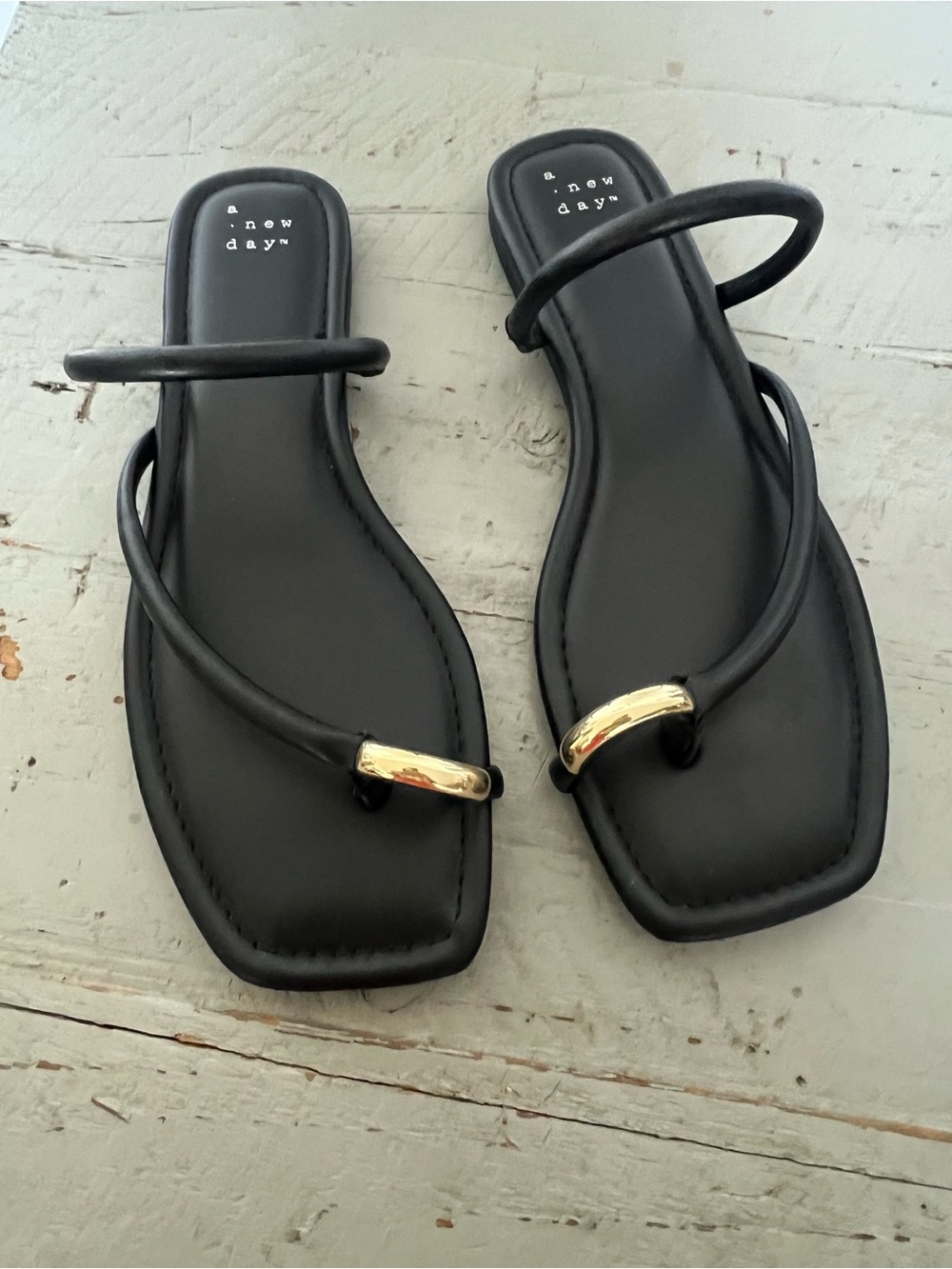 Chic, sleek scrappy sandal with gold accent toe ring